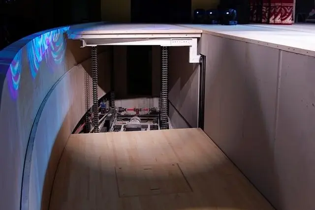 Overview of a typical understage machinery system, illustrating lift platforms, drive mechanisms, and integrated control systems. Overview of a typical understage machinery system, illustrating lift platforms, drive mechanisms, and integrated control systems.
